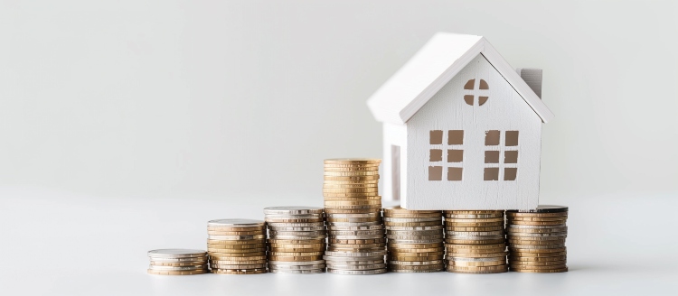 ../../assets/small-pics/medium-vecteezy_white-wooden-house-models-stands-on-a-stacks-of-coins-solid_45805730_medium.jpg